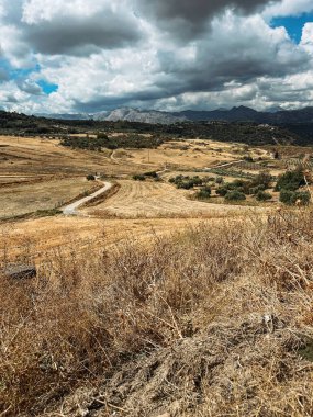 Vast mountainous landscape with cloudy sky. Andalusia, Spain.