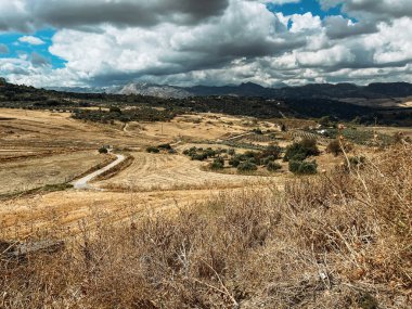 Vast mountainous landscape with cloudy sky. Andalusia, Spain.
