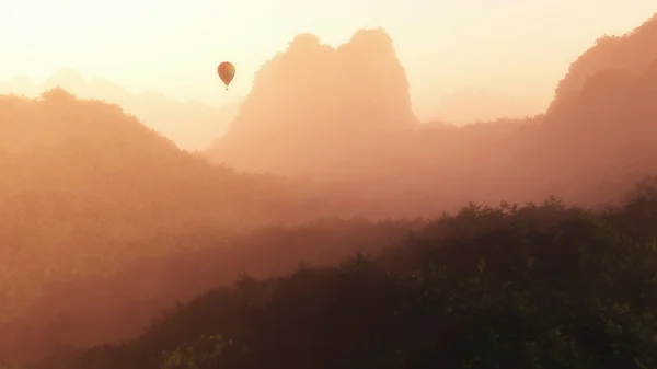 Hot air balloon floating through mountains — Stock Photo, Image