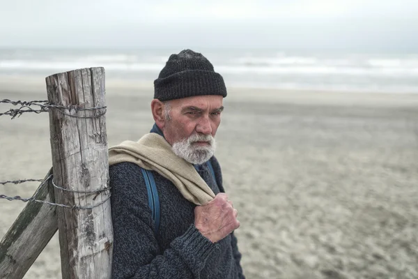 Serious beachcomber on the beach — Stock Photo, Image