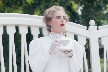 Tea drinking victorian woman clipart