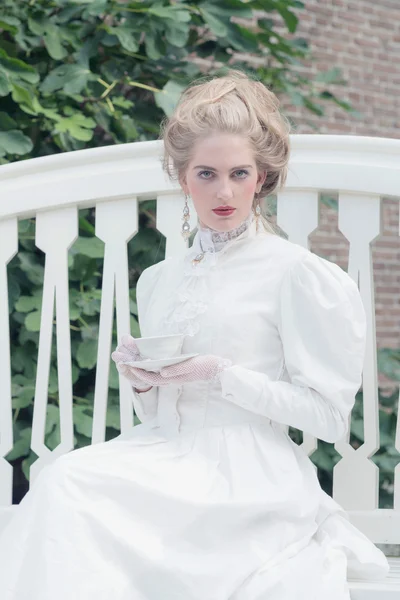 Tea drinking victorian woman — Stock Photo, Image