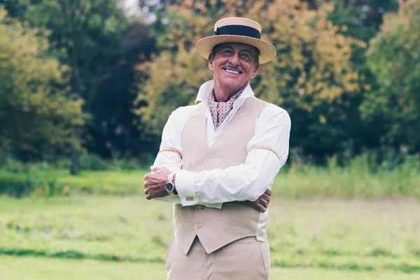 Smiling senior man in suit — Stok fotoğraf