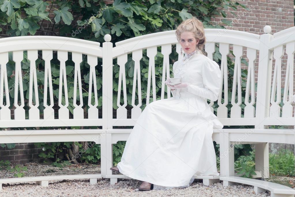 Tea drinking victorian woman