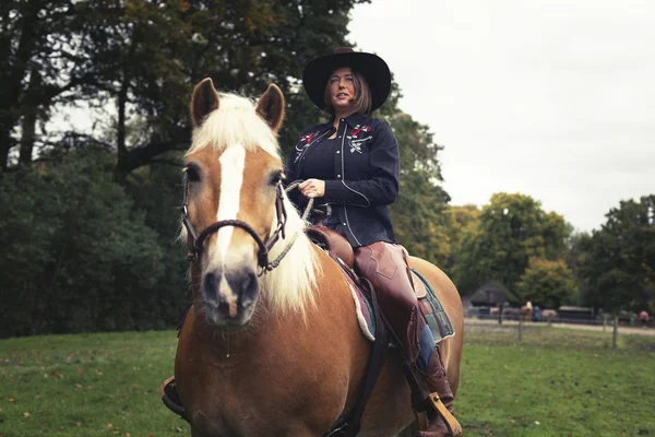 Western style woman horse riding — Stock Photo, Image