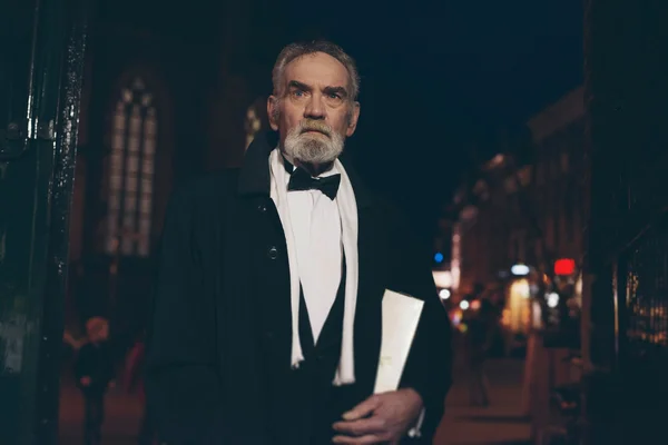 Senior man in tuxedo in city — Stock Photo, Image