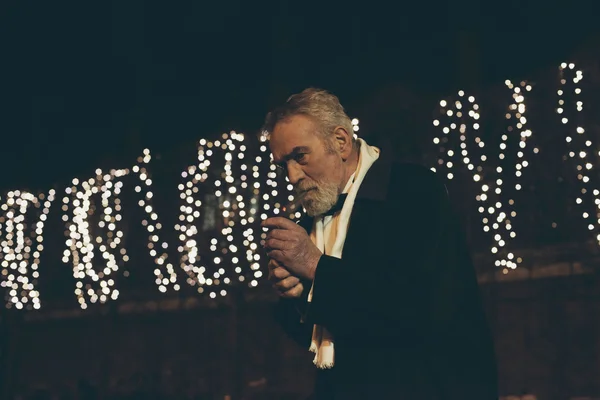 Cigar smoking man in tuxedo — Stock Photo, Image