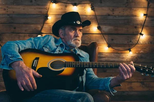 Guitar playing senior musician — Stock Photo, Image