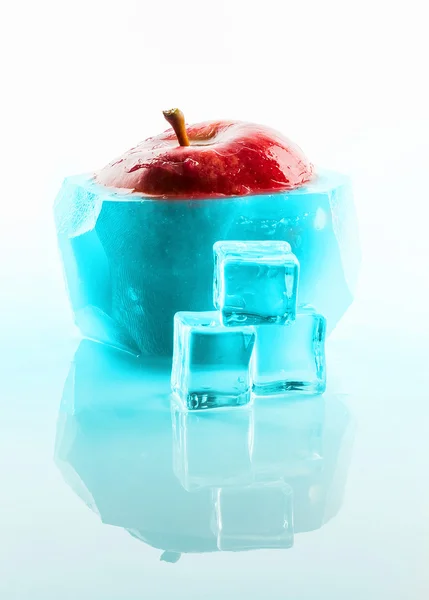 Red apple frozen inside ice — Stock Photo, Image