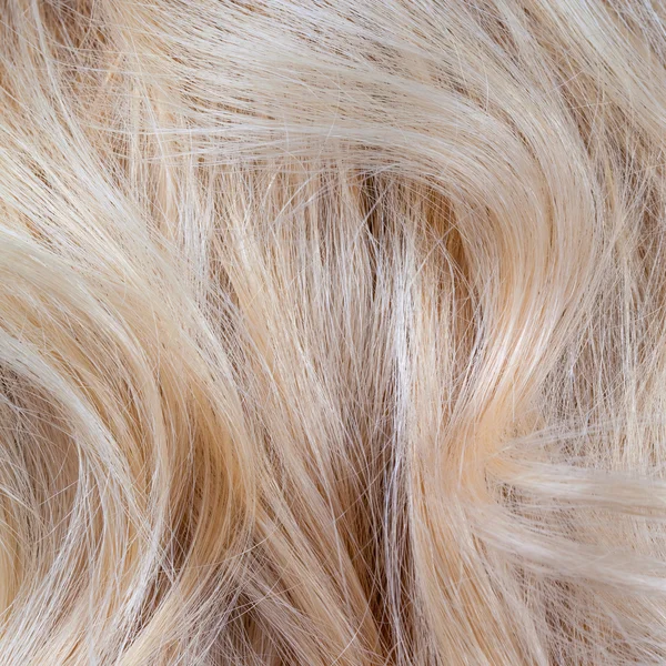 Mujer rubia ondulada pelo fondo y textura — Foto de Stock