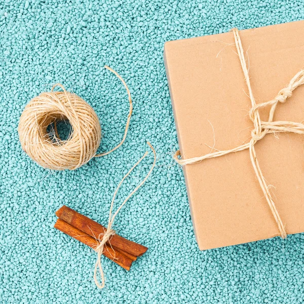 Vintage gift box in eco paper on blue stone background. — Stock Photo, Image