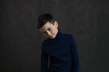 portrait of a serious caucasian guy on a gray background