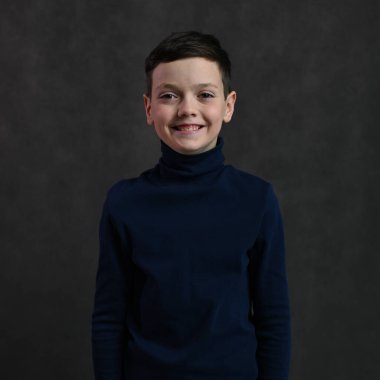 portrait of a cheerful caucasian guy on a gray background
