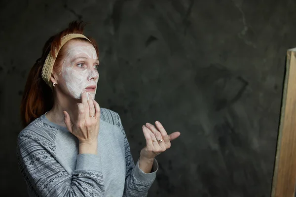 Portrait Caucasian Woman Applying Aging Cosmetics Her Face Front Mirror — Foto de Stock