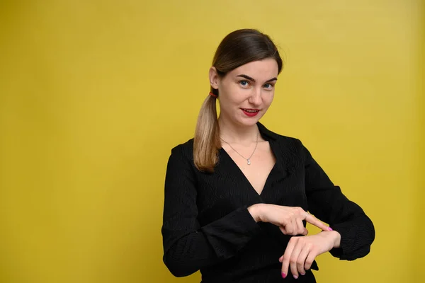 Caucasian Female Manager Shows Wristwatch Time Smile Stands Yellow Background — Stock Photo, Image
