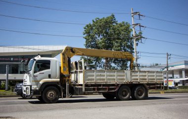 Chiangmai, Thailand -   October 26 2020: Private Isuzu Crane Truck. On road no.1001 8 km from Chiangmai Business Area.
