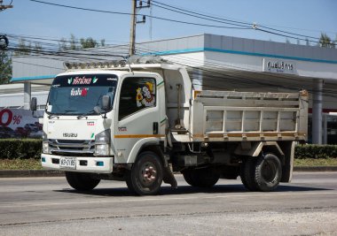 Chiangmai, Thailand -   October 26 2020: Private Isuzu Dump Truck. On road no.1001 8 km from Chiangmai Business Area.