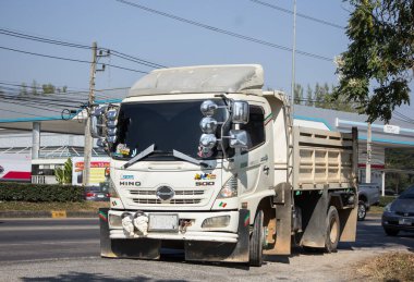 Chiangmai, Thailand - December 17 2020: Private Hino Dump Truck. On road no.1001 8 km from Chiangmai Business Area.