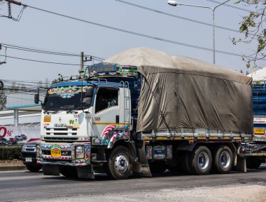 Chiangmai, Thailand - March  4 2021: Private Isuzu  Cargo Truck. Photo at road no.1001 about 8 km from downtown Chiangmai, thailand.