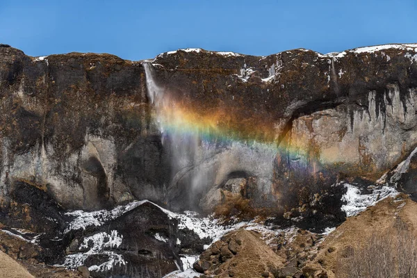 Photo d'une cascade de glace en Islande avec un arc-en-ciel — Photo