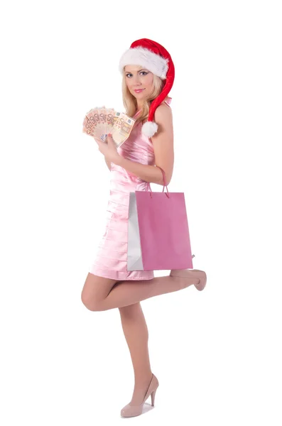 Frau im rosa Kleid mit Weihnachtsmann-Hut — Stockfoto