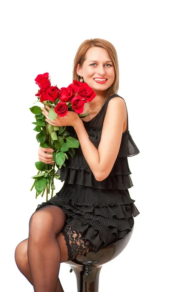 Hermosa mujer ingenio un rojo rosas — Foto de Stock