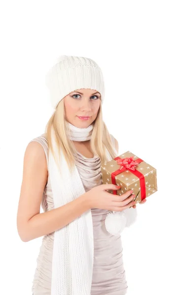 Beautiful girl in winter hat with a gift — Stock Photo, Image