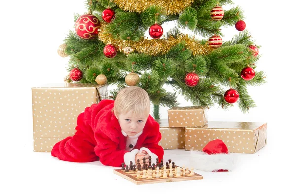 Child dressed as a gnome play chess — Stock Photo, Image