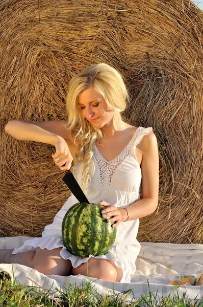 Happy woman posing with watermelon — Stock Photo, Image