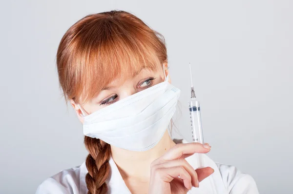 Closeup of a female doctor with syringe — Stock Photo, Image