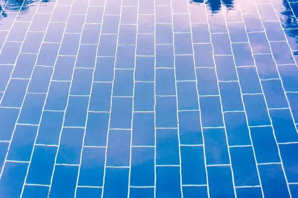 Blue tiled floor of a pool under clear water — Stock Photo, Image