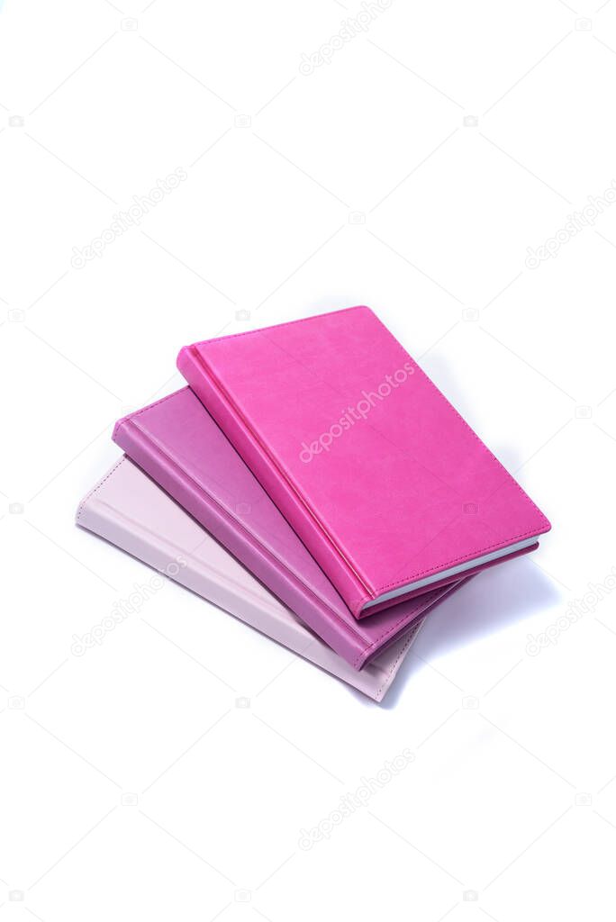 Hardcover notebooks on a white background