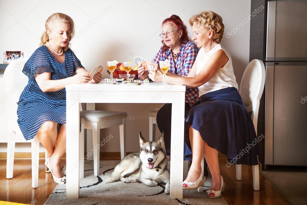 Senior women and cute dog, at home