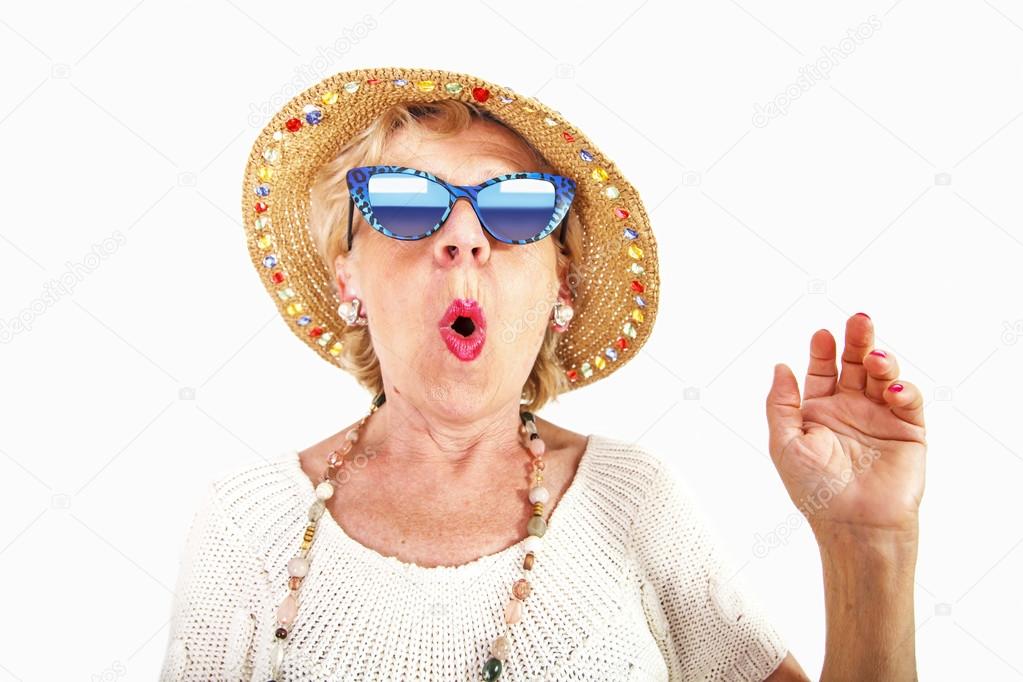 Senior woman wearing sunglasses and hat