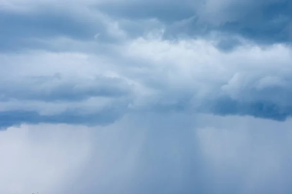 Cumulus clouds, dark blue summer sky of bad weather, thunderstorm beginning of heavy rain