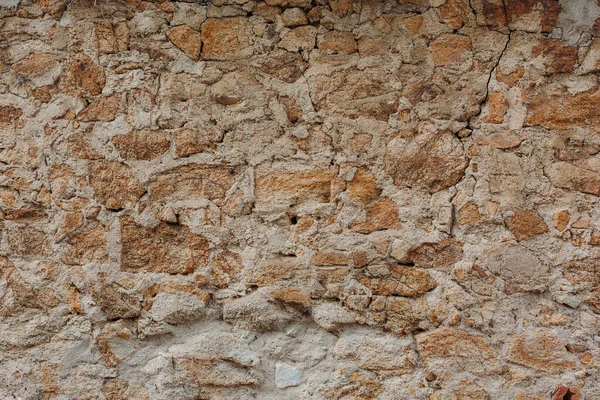 Stenväggskonsistens. Stenvägg som bakgrund eller struktur Stockbild