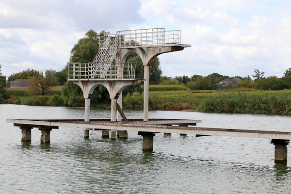 Diving tower on the river in a small village, Ukraine.