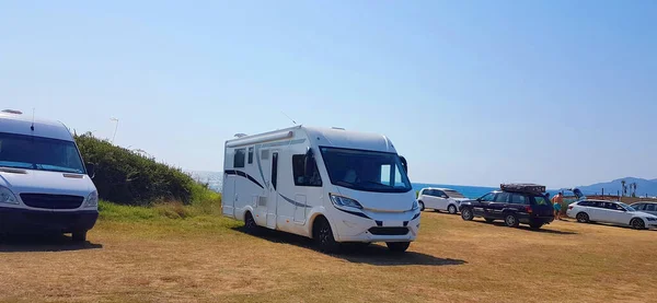caravan trailer car by the sea in summer holidays sunny hot day