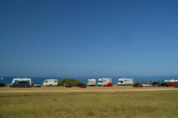 caravans cars by the beach in summer holidays sea sun fun trave