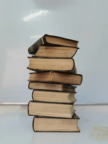 books book  old aged  in the dust pile stack isolated for background