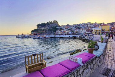 parga greek tourist resort by the sea in the evening , holidays in grece clipart