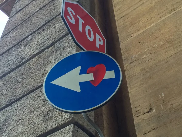 Florence,Italy - 09.05.2017-Road traffic signs ,stop and arrow sign, heart sign. High quality photo