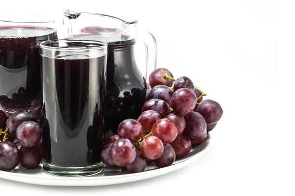 Стакан виноградного сока — стоковое фото