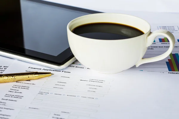 Business report with cup of coffee — Stock Photo, Image