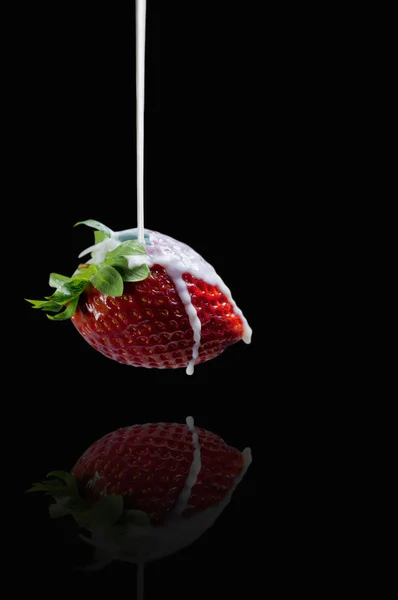 Strawberry and milk on a dark background — Stock Photo, Image