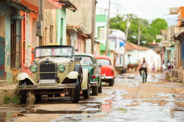Old convertible car on street of Trinidad, Cuba clipart