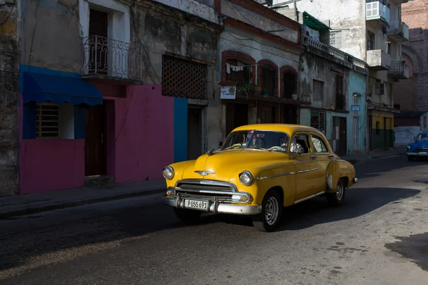 HAVANA - FEBRUARY 17: Classic car and antique buildings on Febru Stock Photo