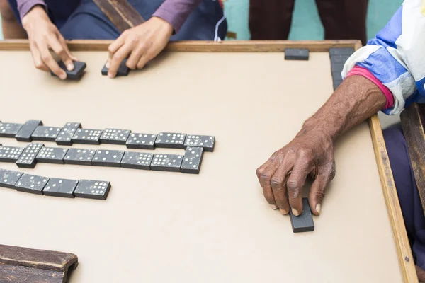 Cropped image of people playing domino on street — Stock Photo, Image