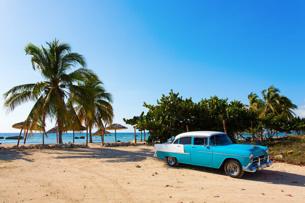 Old classic car on the beach of Cuba