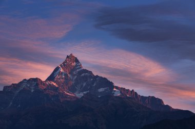 Machhapuchchhre mountain at sunset - Fish Tail in English is a m clipart